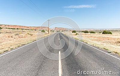 Long straight road ahead through desert of New Mexico, USA. Stock Photo