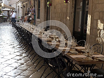 Long table for guests, Dubrovnik old town with stone pavement Editorial Stock Photo