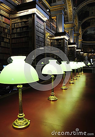 Long table with lamps in library Stock Photo