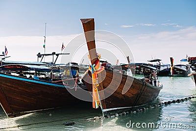 Group of Long tail Boats mooring at Beach and sea Stock Photo