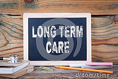 Long term care. health and safety. Chalk board Background Stock Photo