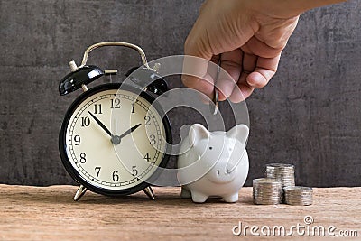 Long term financial saving and investment account, hand putting Stock Photo