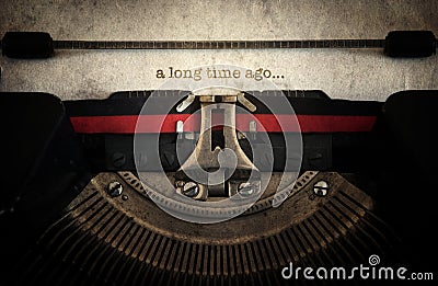 A long time ago typed on old vintage typewriter machine. Retro s Stock Photo