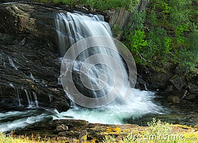 Long Time Exposure Of Baggfossen Falls aka Kebbelvfossen At Leirfjord In Norway Stock Photo