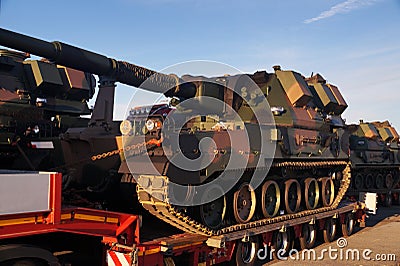 Long vehicle. Over-standard, atypical road transport. A howitzer on the tank chassis. Exceptional convoy Editorial Stock Photo