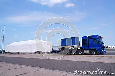 Long vehicle. Over-standard, atypical road transport. A very long and heavy load on a specialized semi-trailer. Exceptional convoy Editorial Stock Photo