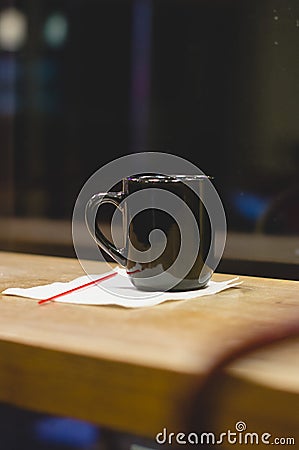 A long view of a black coffee up in the diner window Stock Photo