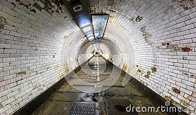 Long vintage tunnel under the river Thames in Greenwich Stock Photo