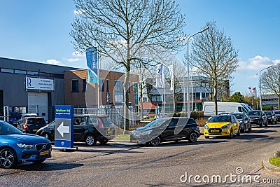 long waiting line at Loogman carwash in Hoofddorp the Netherlands after Sahara sand has fallen on the cars Editorial Stock Photo