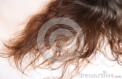 Long wavy brown hair on a teenage girl Stock Photo