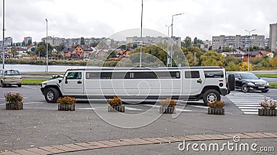 Long white wedding limousine on the embankment of Vinnitsa Stock Photo