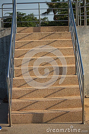 Long wide flight of outdoor steps with stainless steel handrails Stock Photo