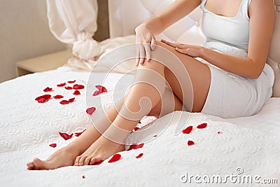 Long Woman Legs. Beautiful Woman Cares About Legs. Depilation Stock Photo