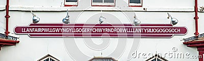 The longest place name of the UK, llanfairpwllgwyngyllgogerychwyrndrobwllllantysiliogogogoch on the public train station Stock Photo