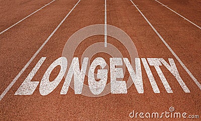 Longevity written on running track, New Concept on running track text in white color Stock Photo