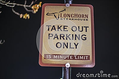 LongHorn Steakhouse Restaurant at night Take Out parking sign Editorial Stock Photo