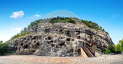 Longmen Grottoes with Buddha`s figures are Starting with the Northern Wei Dynasty in 493 AD. It is one of the four notable Stock Photo