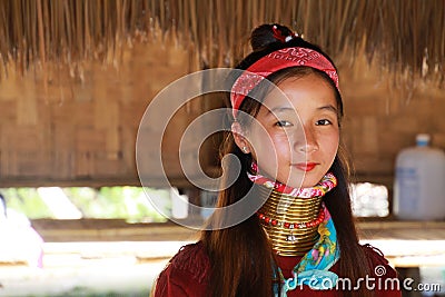 LONGNECK KAREN VILLAGE, THAILAND - DECEMBER 17. 2017: Close up portrait of young long neck girl with Thanaka face painting and Editorial Stock Photo