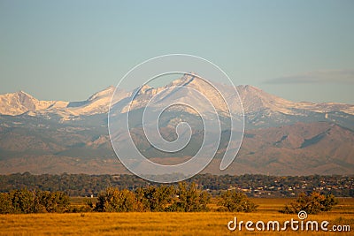 Longs Peak covered in snow from Denver and Commerce City, Colorado Stock Photo