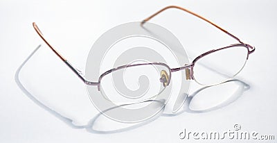Longsighted prescription glasses with shadow arranging on white background Stock Photo