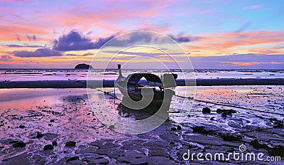 Longtail boat on the beach of Lipe island at dawn Stock Photo