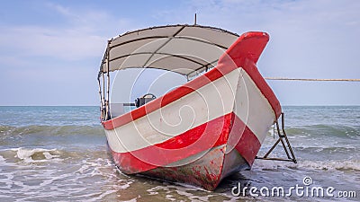 Longtail boat on beach in Malaysia Stock Photo