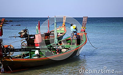 Longtail boat in Thailand with the captain. Editorial Stock Photo