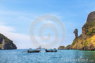 Longtail boats moored floating in andaman sea at Koh Kai or chicken rock island, Krabi, Thailand Editorial Stock Photo