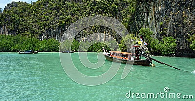 Longtailboat in lagoon Editorial Stock Photo