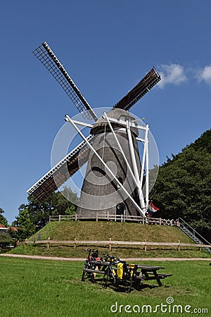 Lonneker windmill, on a artificial hill Belt with picnicplace and bicycles Stock Photo