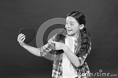 Look at this big heart. Cute girl in love. Having heart problem and heartache. Happy valentines day. Little girl Stock Photo