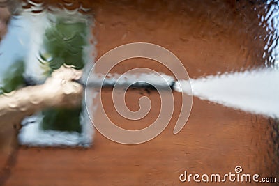 Look through the blurred rear windshield of a car at a heavy downpour, flood Stock Photo