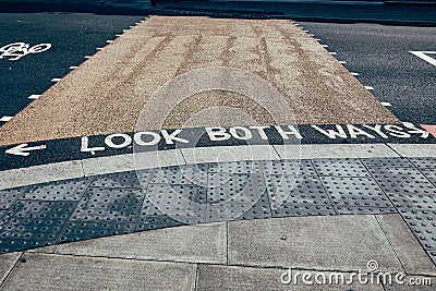 `Look both ways` road marking on a pedestrian crossing, London, UK Stock Photo