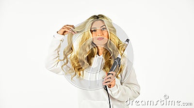 Look at this. Girl care about hairstyle. Fashion and beauty. Stylist curling hair. fashion model woman. Beautiful blonde Stock Photo