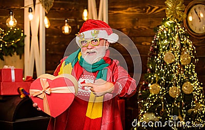 Look here. Generosity. Spread love. Charity concept. Generous donation. Charity help. Man senior bearded Santa claus Stock Photo