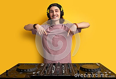 Look, i will play on it. dj man with his equipment Stock Photo