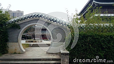 Look at the scenery through the round gate. Stock Photo
