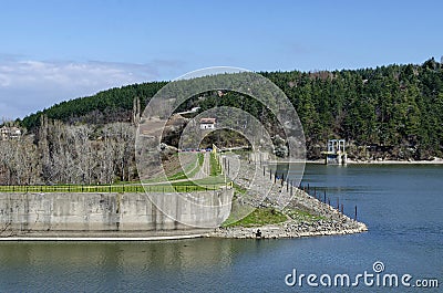 Look toward barrage wall of picturesque dam Stock Photo