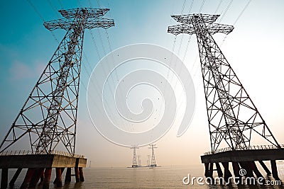 The high-voltage power transmission towers Stock Photo