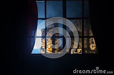 Look through a window and city night view. Realistic dollhouse window and city miniature Stock Photo