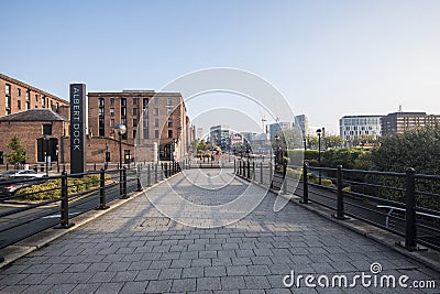 The Albert Dock area of Liverpool just after sunrise, with low sun and long shadows Editorial Stock Photo