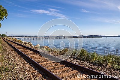 Looking along train line to White Rock pier, BC Editorial Stock Photo