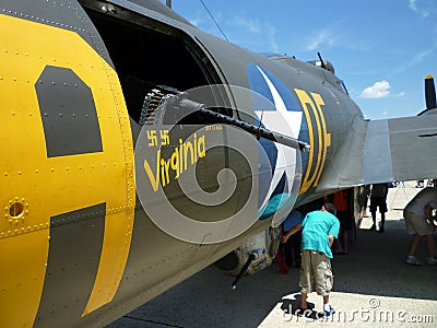 Looking at the B17 Bomber's Guns Editorial Stock Photo