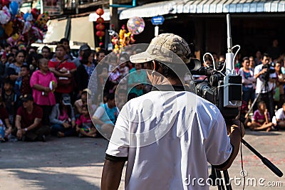 Looking through the back of the video camera with the crowd. Editorial Stock Photo