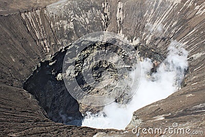 Looking into big crater of active Bromo Volcano in Indonesia Stock Photo