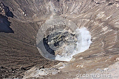 Looking into big crater of active Bromo Volcano in Indonesia Stock Photo