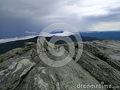 Looking at the breathtaking sight at top of the mountain Stock Photo