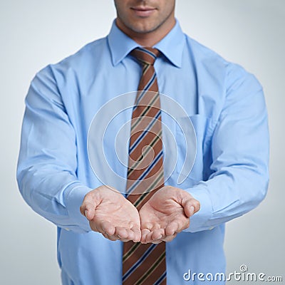 Looking for a corporate bailout. Studio shot of a businessman with his open palm raised to the camera. Stock Photo