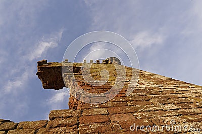 Looking directly up the thick sandstone walls of the Keep of the ruined Red Castle at Lunan Stock Photo