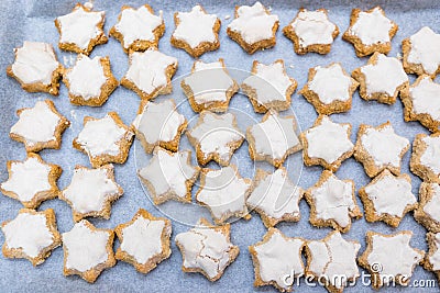 Looking down on flat lay of home baked imperfect star shaped cin Stock Photo